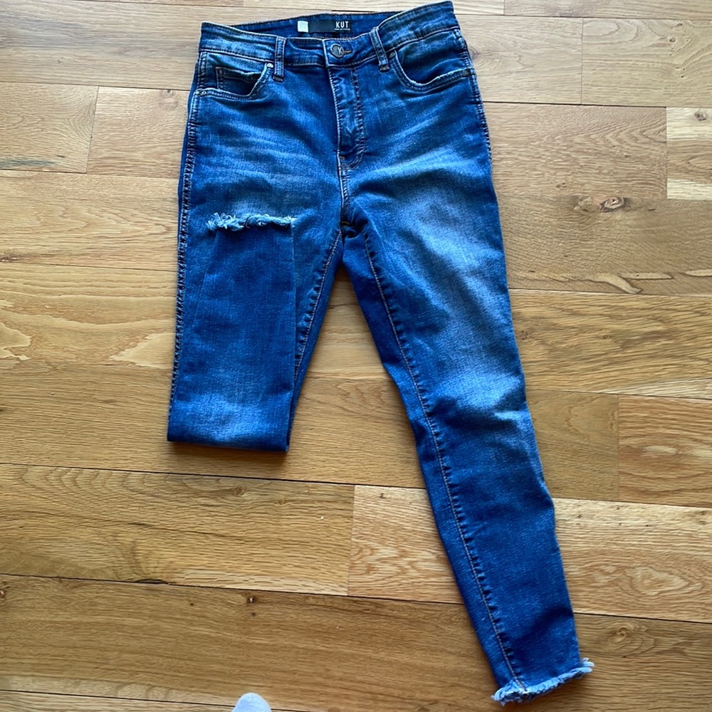 KUT narrow, ankle, fringe bottom jeans.